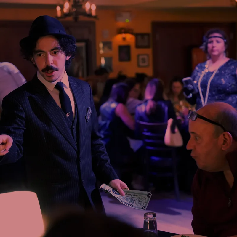A detective questioning a guest at a Milwaukee show